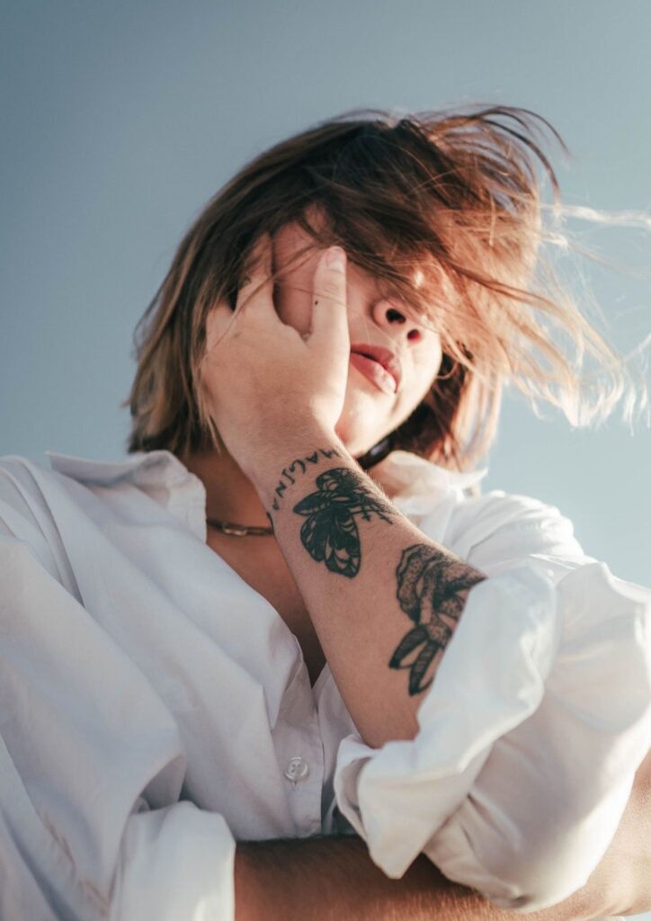 Woman with tattoo outside
