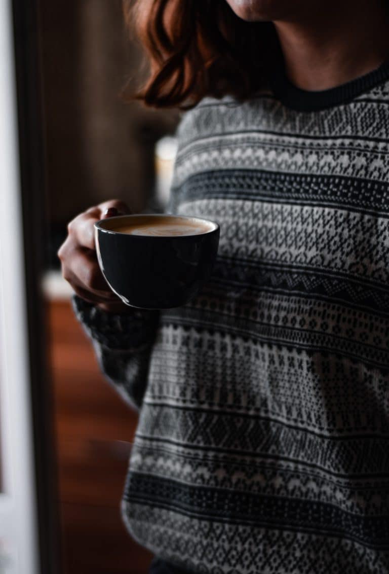 young girl drinking a latte